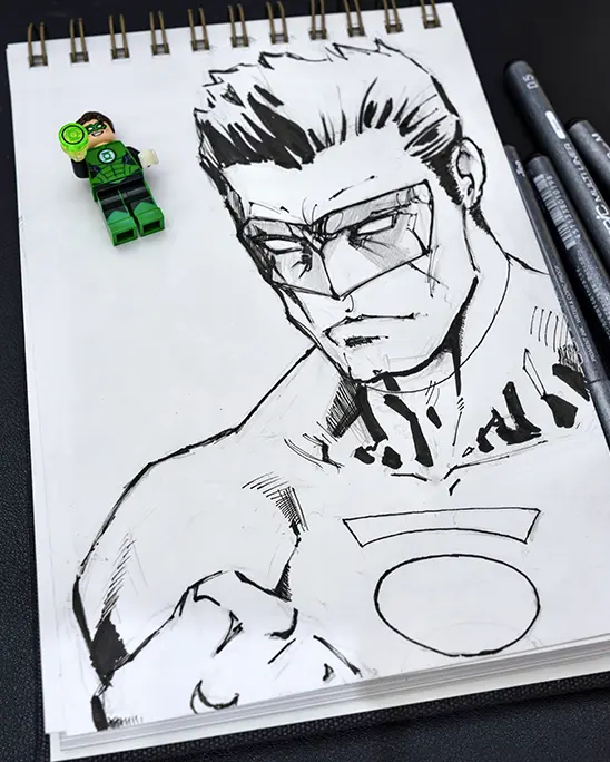  LEGO Green Lantern minifigure posed beside a dynamic ink sketch of Hal Jordan.