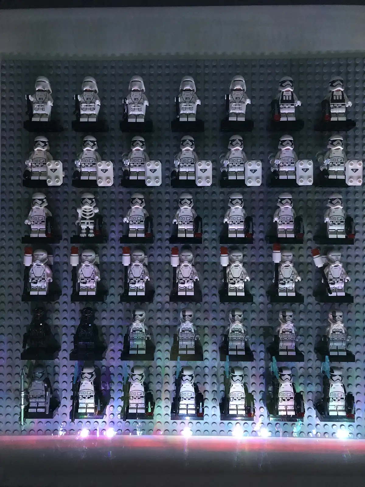 An IKEA frame housing a display of LEGO Stormtroopers.