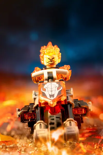 LEGO Marvel Ghost Rider figure with Ryan Gosling's likeness, standing in a dramatic pose against a dark background.