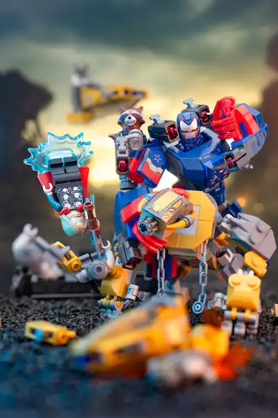 LEGO Iron Patriot Mk. 2 with Rocket Raccoon riding into battle, surrounded by destroyed machines.