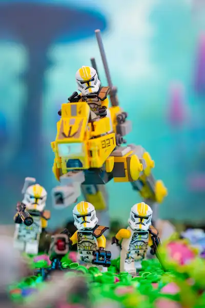 LEGO 327th Star Corps clones advance through alien flora with an AT-RT walker.