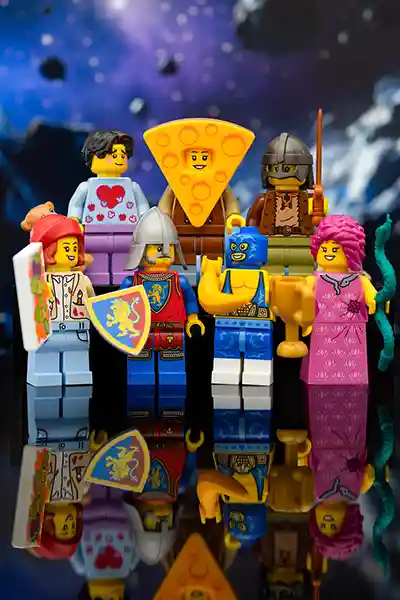 A lineup of LEGO minifigures from the January 2025 Build-a-Minifigure series, featuring a variety of costumes and accessories, posed together in a bright city setting.