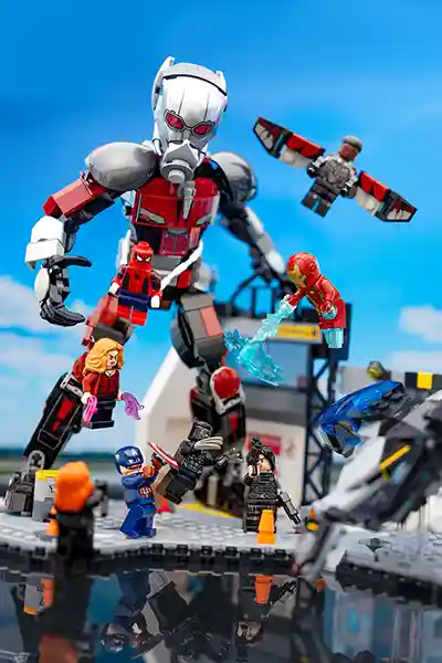 LEGO Marvel minifigures reenacting the airport battle from Captain America: Civil War, featuring Giant-Man, Iron Man, Spider-Man, Captain America, and others in combat.